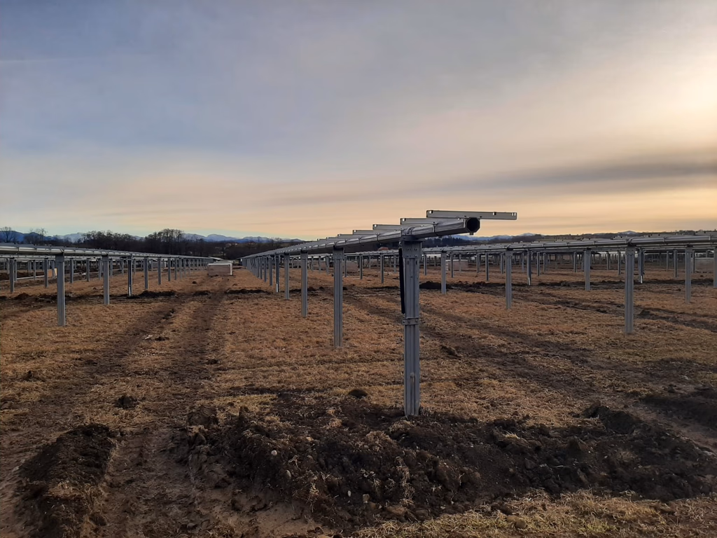 Single-axis tracker solar field at sunset